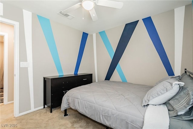 carpeted bedroom with ceiling fan, visible vents, and baseboards