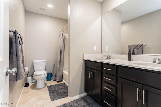 bathroom with toilet, double vanity, a sink, and shower / bath combo with shower curtain