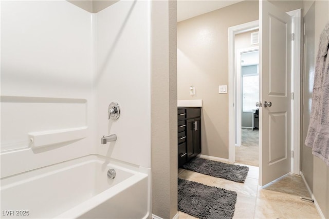 full bathroom featuring shower / bath combination, vanity, and baseboards