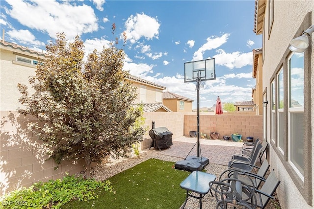 view of patio featuring a fenced backyard and grilling area