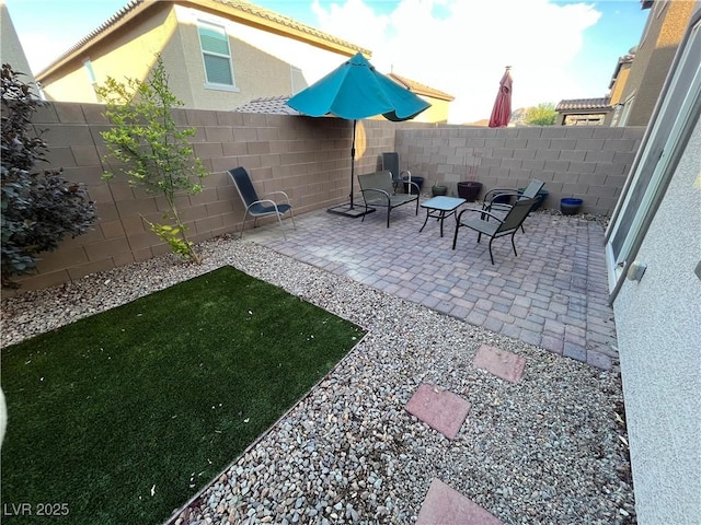 view of patio with a fenced backyard