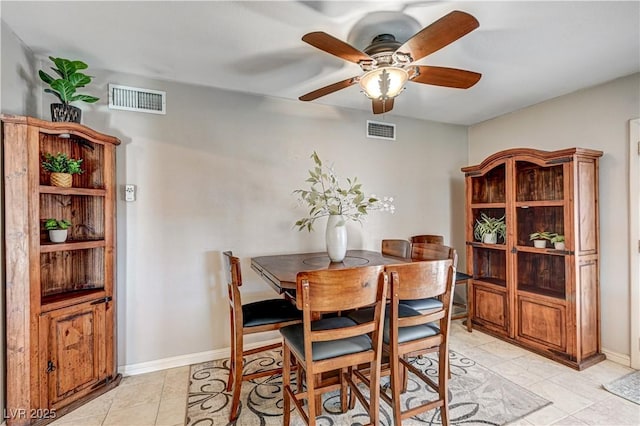 dining room with ceiling fan and light tile patterned floors