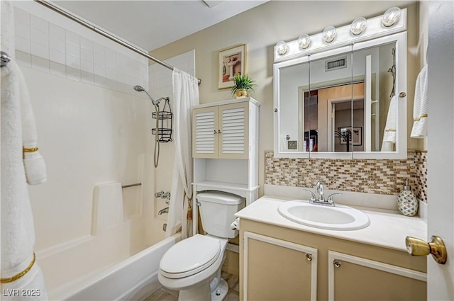 full bathroom featuring tasteful backsplash, vanity, shower / tub combo, and toilet