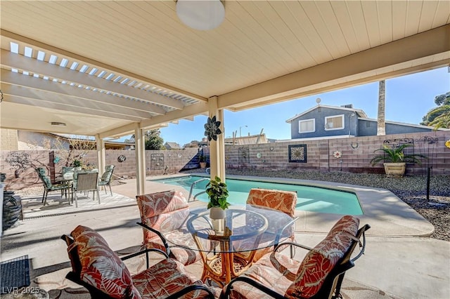 view of patio with a pergola and a fenced in pool