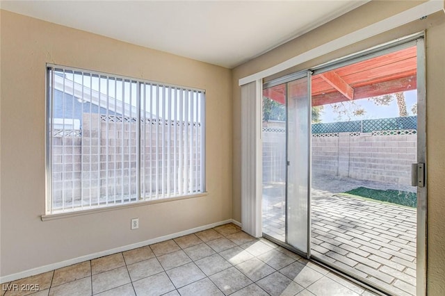 doorway featuring light tile patterned flooring