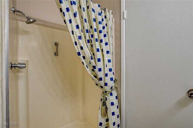 interior space featuring a shower with curtain