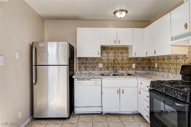 kitchen featuring sink, stainless steel refrigerator, dishwasher, black gas stove, and ventilation hood