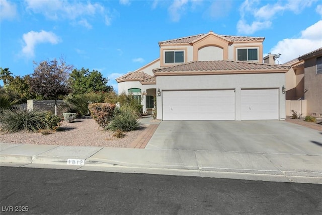 mediterranean / spanish-style house featuring a garage