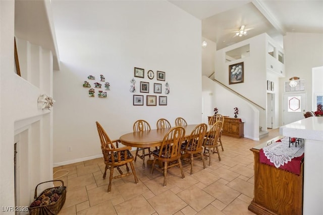 dining space featuring beamed ceiling and high vaulted ceiling