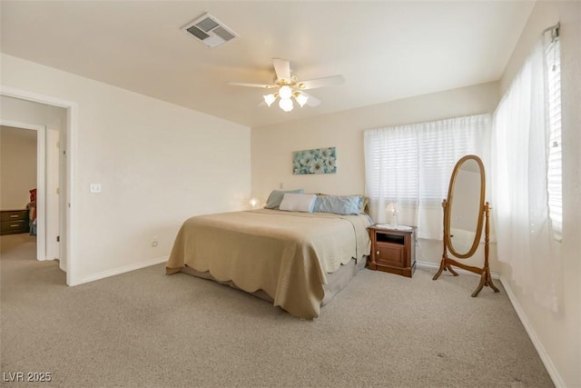 bedroom with ceiling fan and light carpet