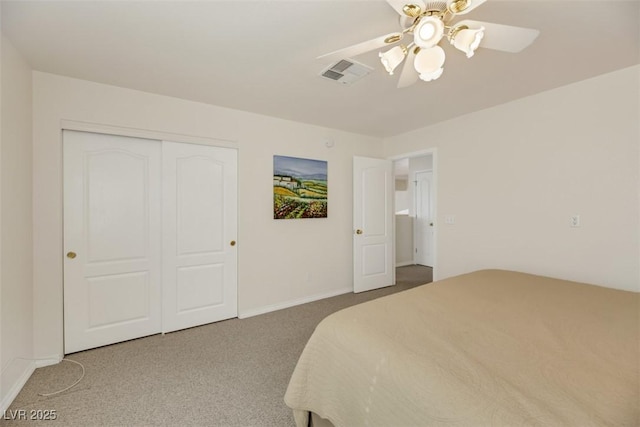 carpeted bedroom featuring a closet and ceiling fan