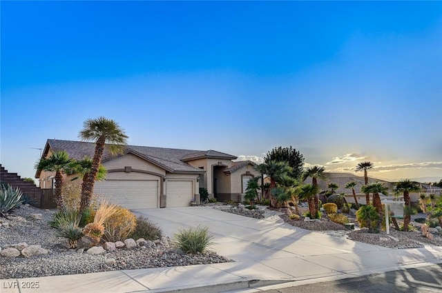 view of front of property with a garage