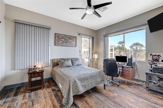 bedroom with wood-type flooring and ceiling fan