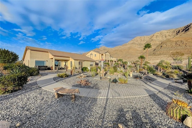 rear view of house featuring a mountain view