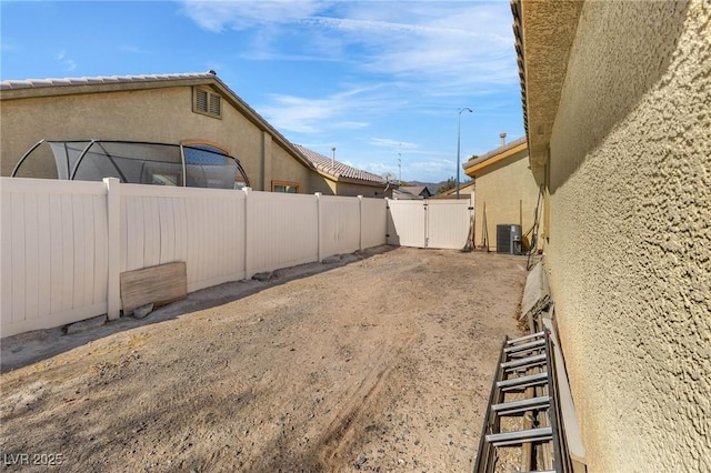 view of yard featuring central AC