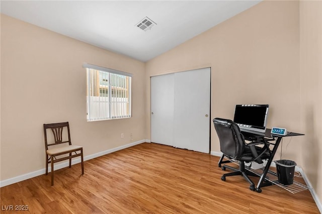 office area featuring lofted ceiling and light hardwood / wood-style flooring