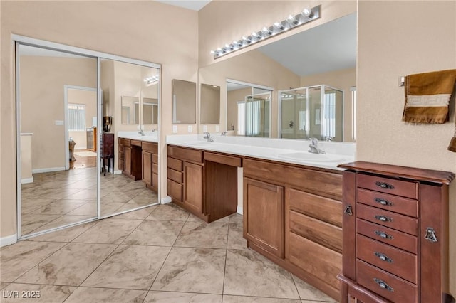 bathroom with vanity and a shower with shower door