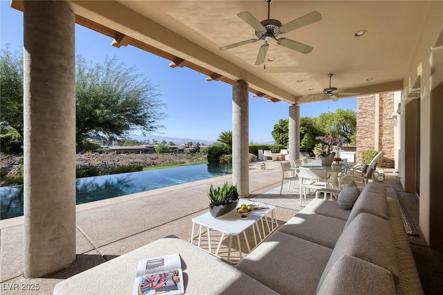 view of patio with an outdoor hangout area, outdoor dining area, and a ceiling fan