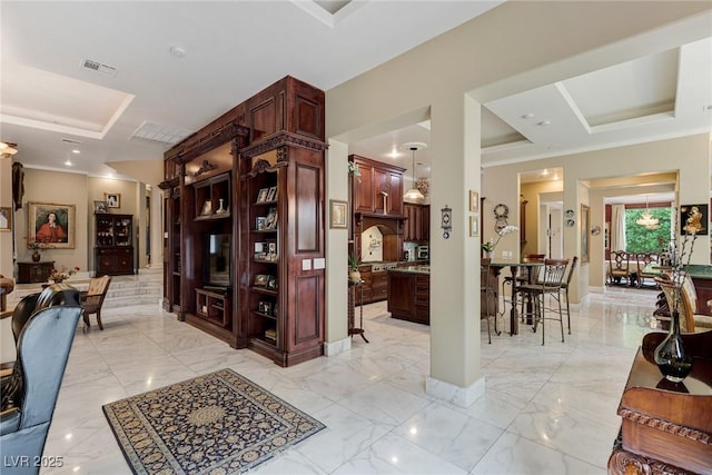 hall featuring a tray ceiling