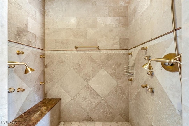 bathroom with tiled shower