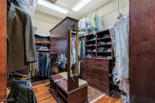 spacious closet with light hardwood / wood-style floors