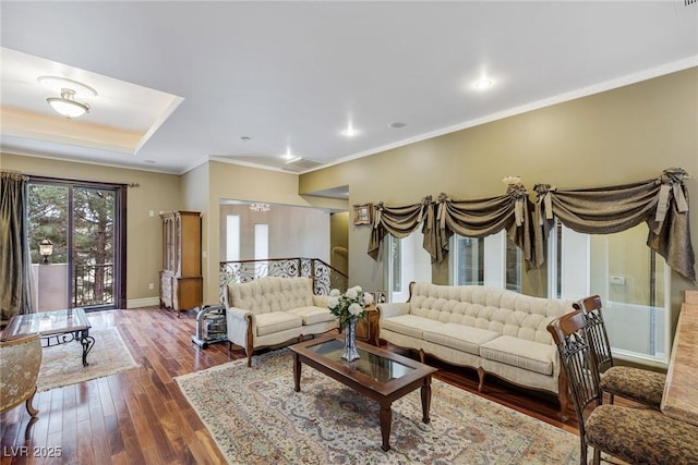 living room with ornamental molding and dark hardwood / wood-style floors