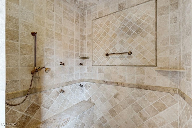 bathroom featuring a tile shower