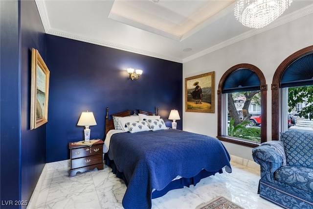 bedroom featuring ornamental molding, a tray ceiling, and a notable chandelier