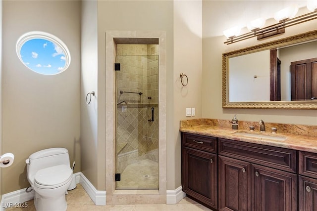 bathroom featuring toilet, vanity, tile patterned floors, and a shower with shower door