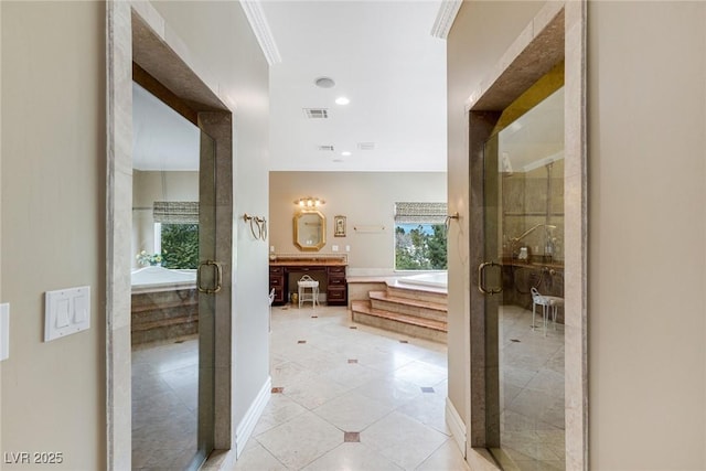 hallway with light tile patterned floors