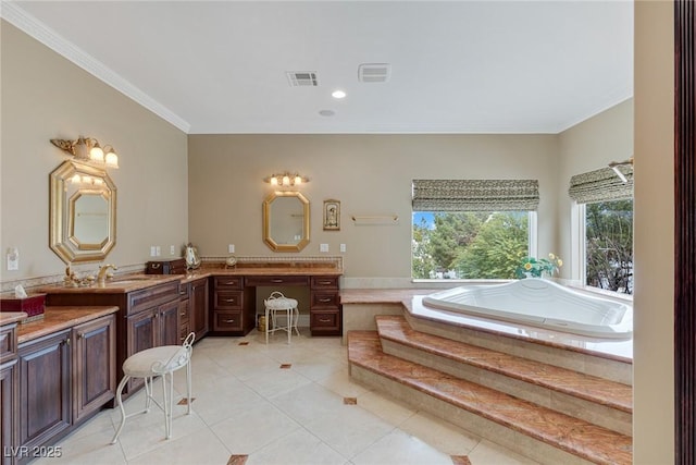 bathroom with tile patterned flooring, vanity, crown molding, and a relaxing tiled tub