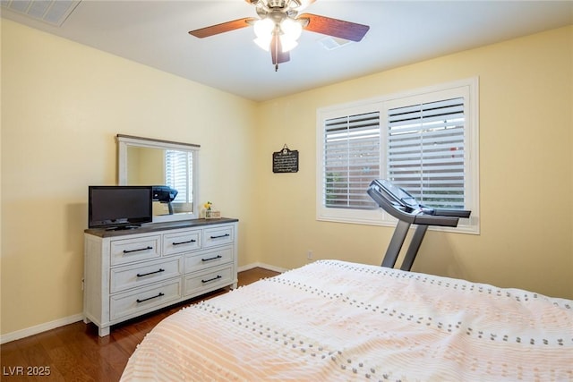 bedroom with ceiling fan and dark hardwood / wood-style flooring