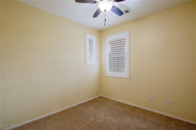 carpeted empty room with ceiling fan