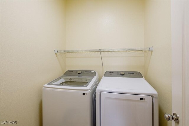 washroom with separate washer and dryer