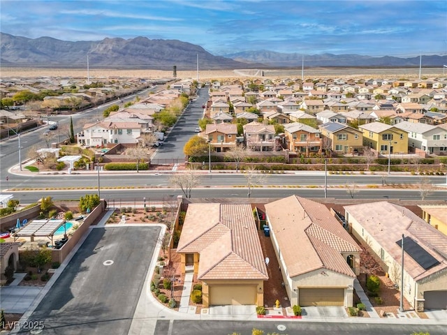 birds eye view of property featuring a mountain view