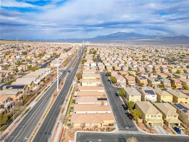 birds eye view of property featuring a mountain view