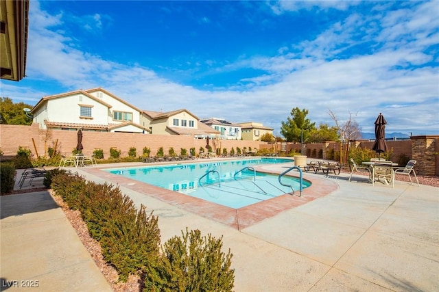 view of swimming pool with a patio