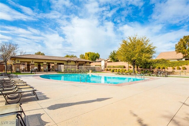 view of swimming pool with a patio area