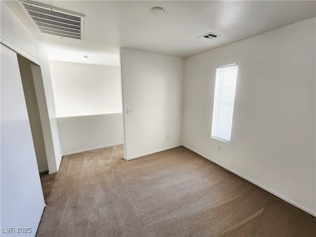 empty room featuring carpet floors