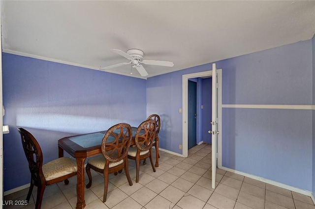 dining space featuring ceiling fan and light tile patterned floors