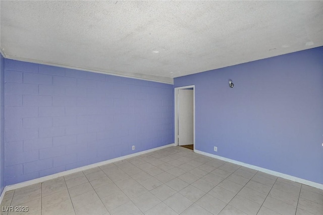 spare room with a textured ceiling