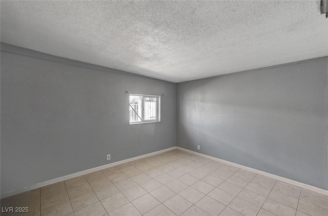 unfurnished room with a textured ceiling