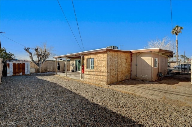 back of house with a patio