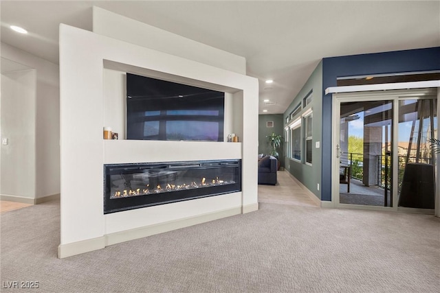 unfurnished living room featuring light carpet