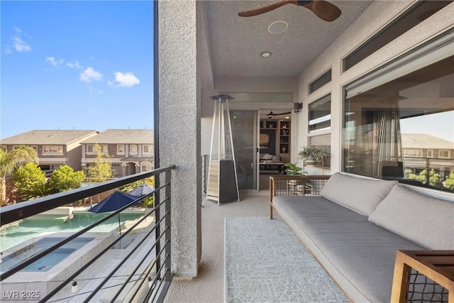 balcony featuring outdoor lounge area and ceiling fan