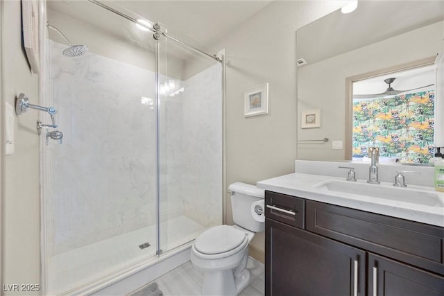 bathroom featuring vanity, toilet, and walk in shower