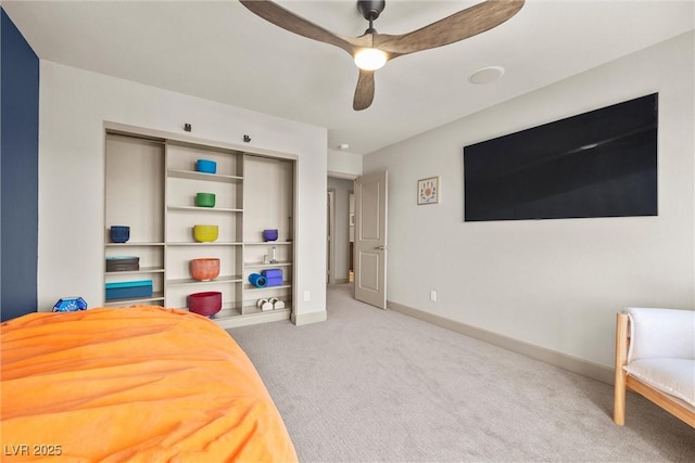 carpeted bedroom with ceiling fan