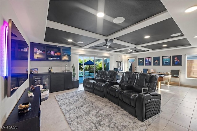 tiled home theater room with coffered ceiling, bar area, and ceiling fan