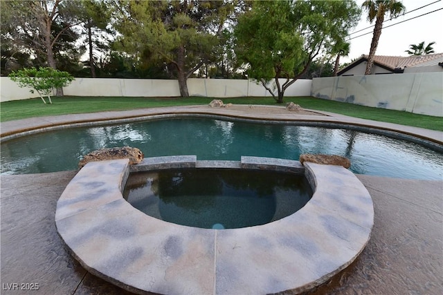 view of pool with an in ground hot tub