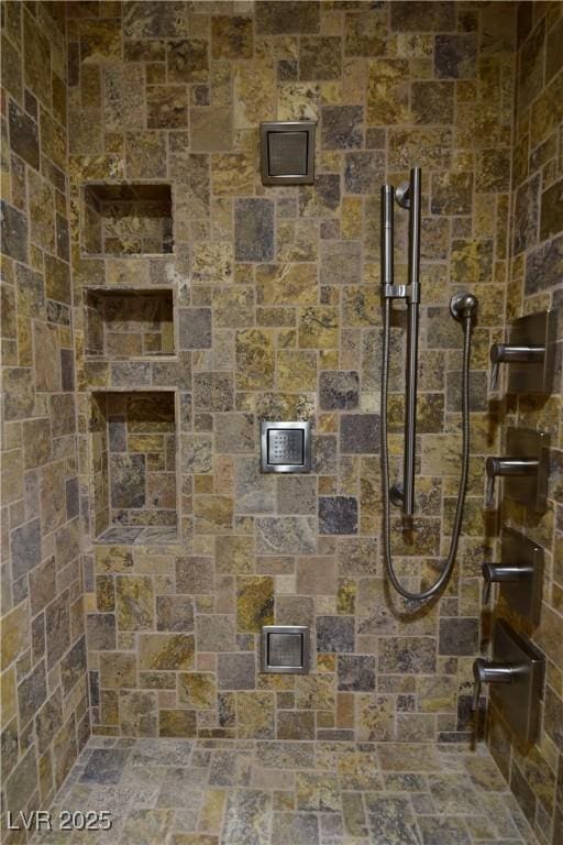 interior space featuring tiled shower